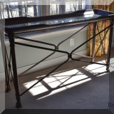F31. Glass and metal console table. 31”h x 53”w x 16”d 